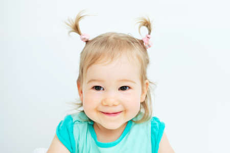 Portrait of a happy caucasian child at home.の写真素材
