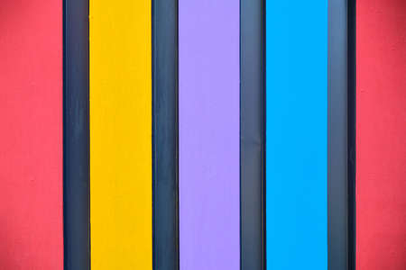 Wooden background with painted colorful boards close up.の写真素材