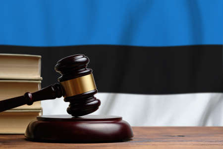 Justice and court concept in Republic of Estonia. Judge hammer on a flag background.の写真素材