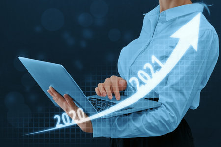 Business growth and profit 2021 concept with woman on background and up arrow.