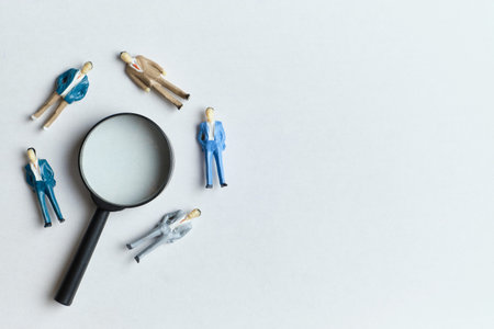 New employee search concept for work with magnifying glass and copy space.