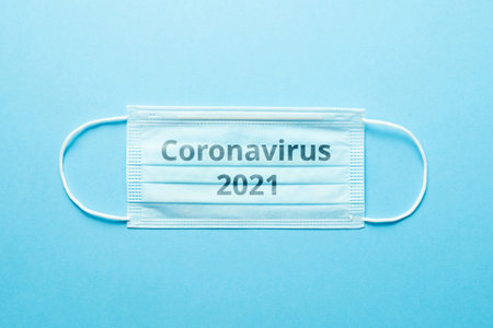 Concept of the second wave of coronavirus covid-19 on a medical mask in 2021.の写真素材