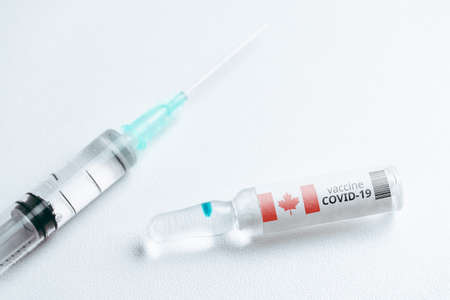 Canada developments of a coronavirus covid-19 vaccine in a glass ampoule.の写真素材