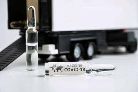 Concept for delivering coronavirus vaccine covid-19 in ampoules by truck.の写真素材