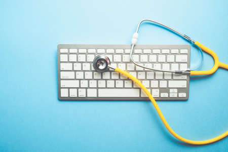 Online doctor concept with stethoscope on keyboard top view ..の写真素材