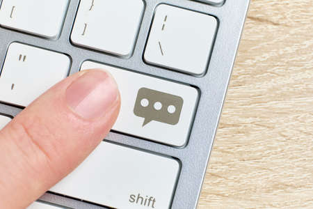 Person clicks on a button with an online chat.の写真素材