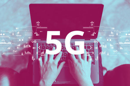 5G mobile networks with a background of a person with a laptop.