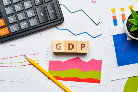 Gross Domestic Product concept with graphs and reports on paper.