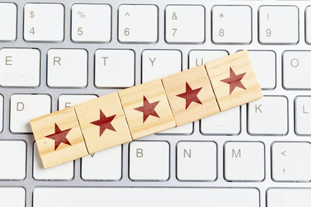 Concept of the highest rating of five stars on the keyboard.