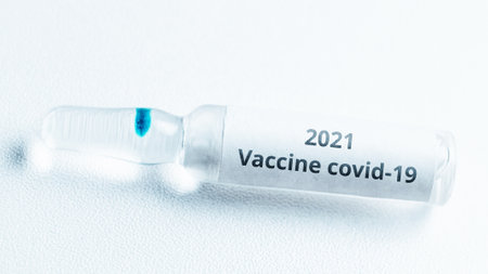 Covid vaccine concept in 2021. Ampoule with medicineの写真素材