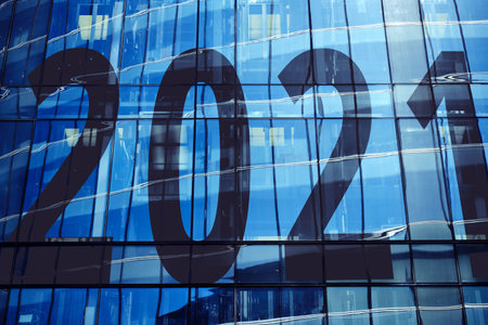 Year 2021 on the facade of a skyscraper on a bright day