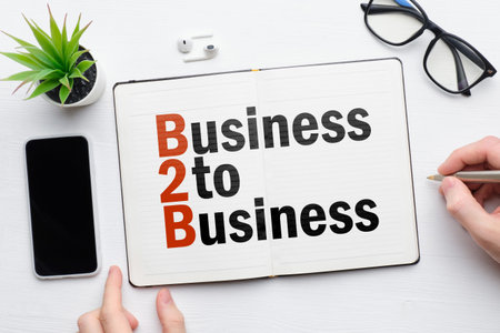 B2b concept. Business to Business on a notebook with person makes notes
