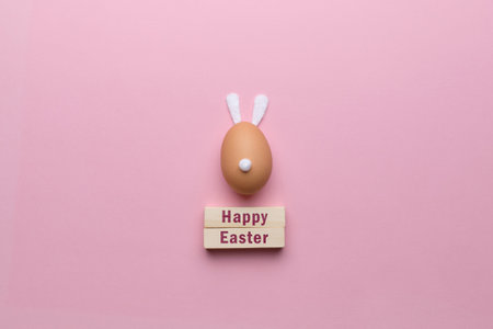 Abstract rabbit made of eggs with ears and a tail. Happy easter concept.