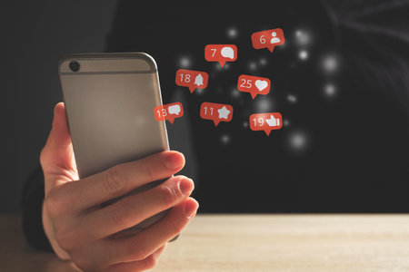 Social media concept with online activity. Person uses a smartphone.