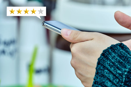 Star rating concept. The person uses a smartphone and gives feedback