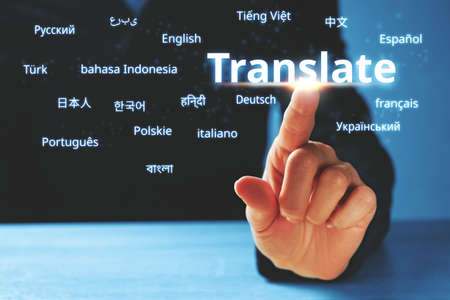 Person abstractly presses on the display with the word translate and foreign languages.の写真素材