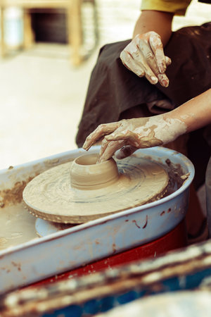 Pottery master makes dishes on the street.の写真素材