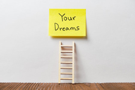 Concept of your dreams written on a sticker under the stairs.