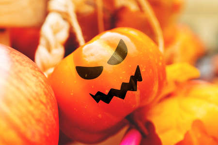 A gloomy face painted on a pumpkin. Halloween holidayの写真素材