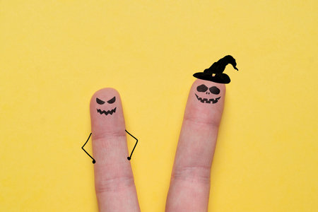 Spiteful faces painted on the fingers. Halloween holidayの写真素材