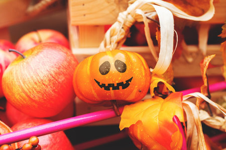 Cheerful face painted on a pumpkin. Halloween holidayの写真素材