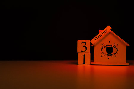 Mysterious house with the eye sign and October calendar with copy space. Halloween holidayの写真素材