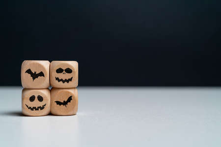 Abstract emotions with bats on wooden cubes with copy space. Halloween holidayの写真素材