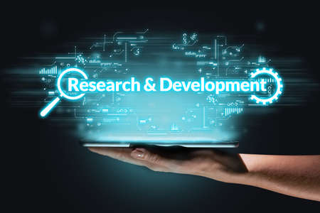 Business acronym RD or Research and Development. Person holding a tablet.の写真素材