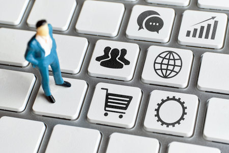 Concept CRM or Customer Relationship Management. An abstract manager stands on a keyboard with...