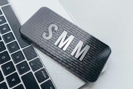 Concept social media marketing or smm. Text on smartphone and laptop.の写真素材