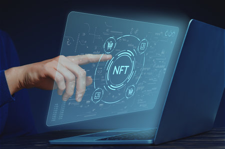 Crypto business concept NFT or non-fungible token. Selling and buying pictures. Hand person with laptop.の写真素材