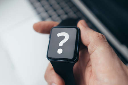 Question mark concept or FAQ. Sign on smart watch.の写真素材