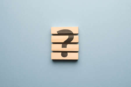 Question mark concept or FAQ. Sign on wooden blocks.の写真素材