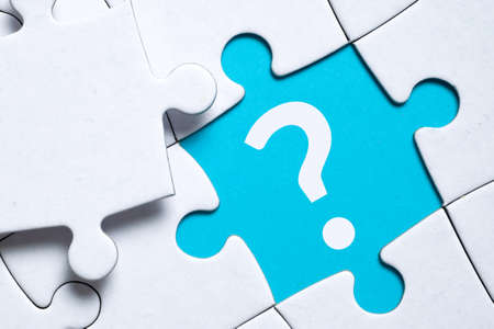 Question mark concept or FAQ. Sign in a puzzle.の写真素材