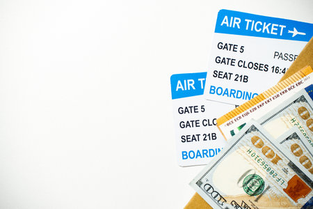 Air travel concept with tickets and money on the table with copy space.