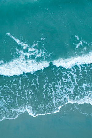 View of the ocean with waves from a high point from top to bottom.