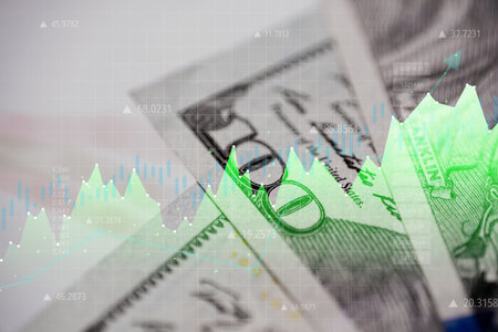 Economic growth in the United States of America. Paper banknotes with graphics.