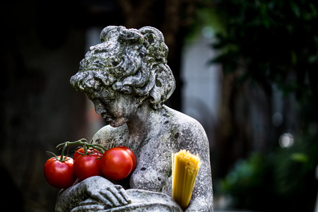 Statue of woman with tomato and spaghettiの写真素材