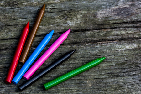 Wax crayons colors on rustic tableの写真素材