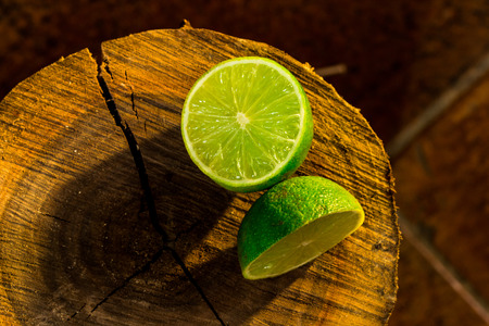 Lime on a tree trunk cutの写真素材