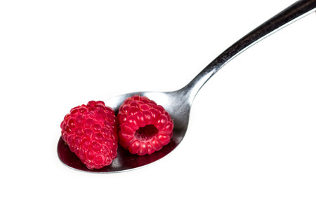 Raspberries in spoonの写真素材