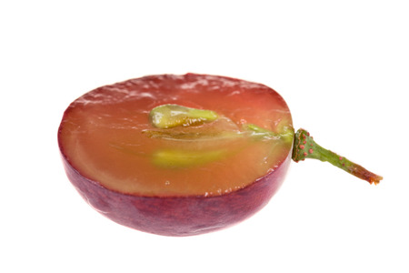 Dark grape half isolatedの写真素材