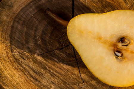 Pear on a tree trunk cutの写真素材