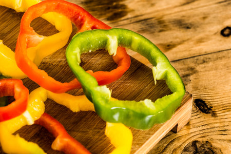 Sliced peppers on a rustic wooden table