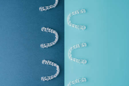 Transparent and invisible dental aligner for orthodontic treatment with blue caseの写真素材
