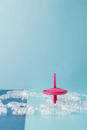 Transparent and invisible dental aligner for orthodontic treatment with fun colored spinning topsの写真素材