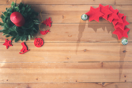 Christmas decoration on a wooden craft table in a family's home for Christmas and New Years Eveの写真素材