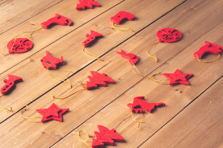 Christmas decoration on a wooden craft table in a family's home for Christmas and New Years Eveの写真素材