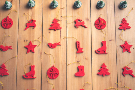 Christmas decoration on a wooden craft table in a family's home for Christmas and New Years Eveの写真素材