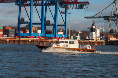 Hamburg Germany - December 16. 2017: Pilot boat sailing fast in port of Hamburgのeditorial素材